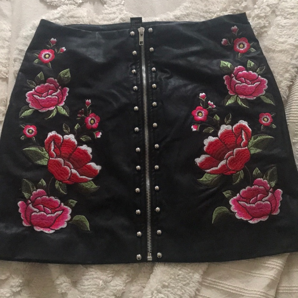 Leather skirt with floral and stud embellishment